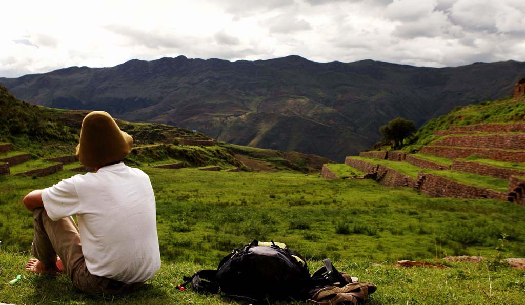A traveller on a tour of Peru looking out over South Valley in Cusco 
